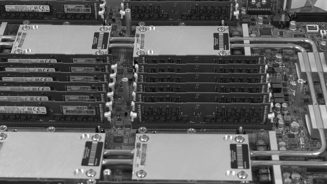 A server board with CPU cold plates and rows of memory